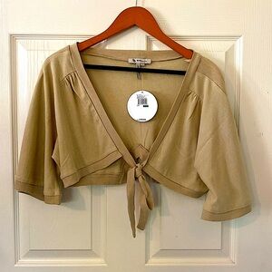 Cropped cardigan, ties in the front, size large. Beige/ light brown.